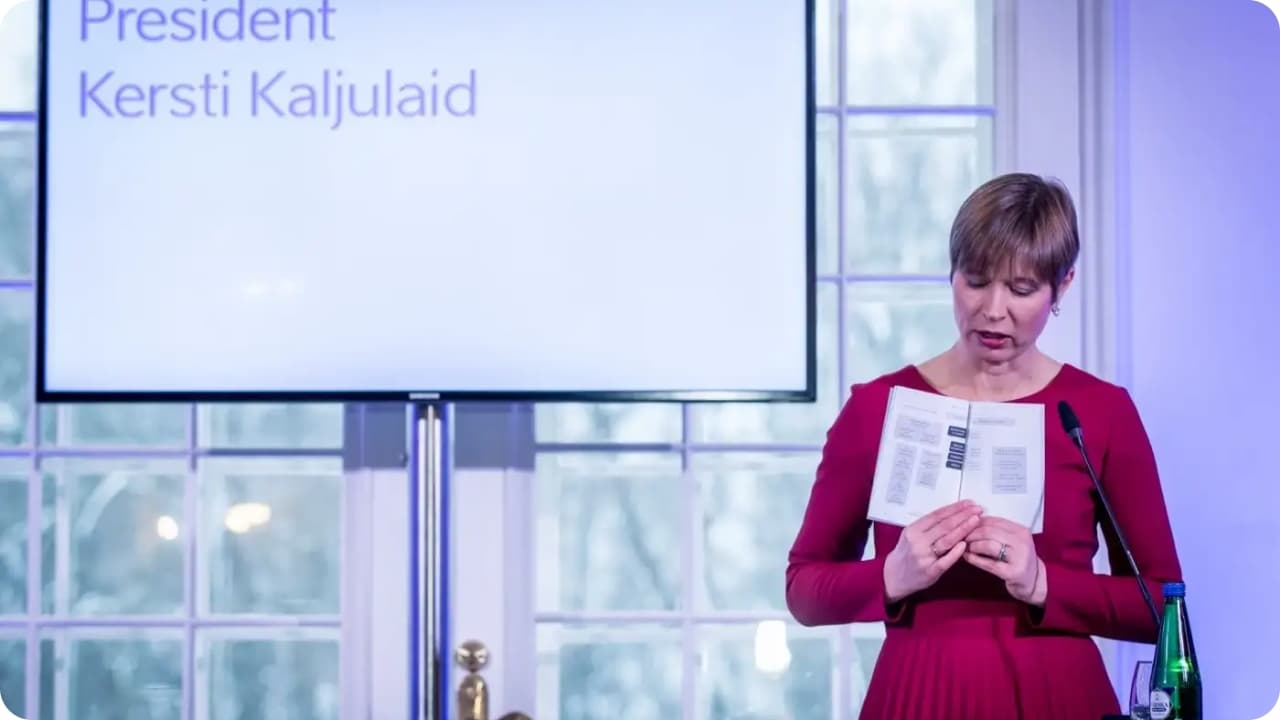 President Kersti Kaljulaid showing e-Residency's whitepaper
