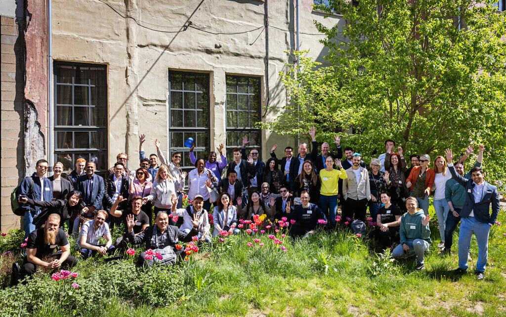 Group shot outside in the garden of participants at the e-Residency study trip for startup entrepreneurs in 2024