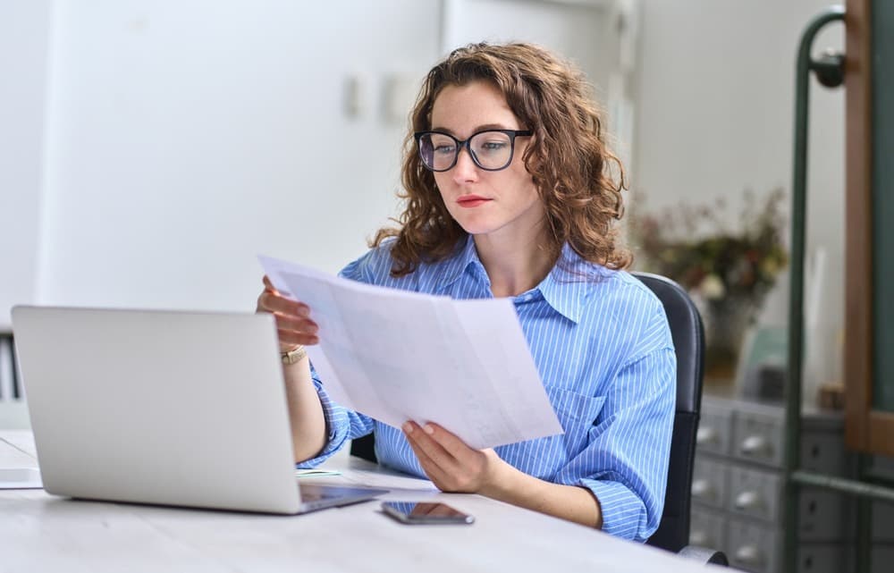 A woman looking at a paper
