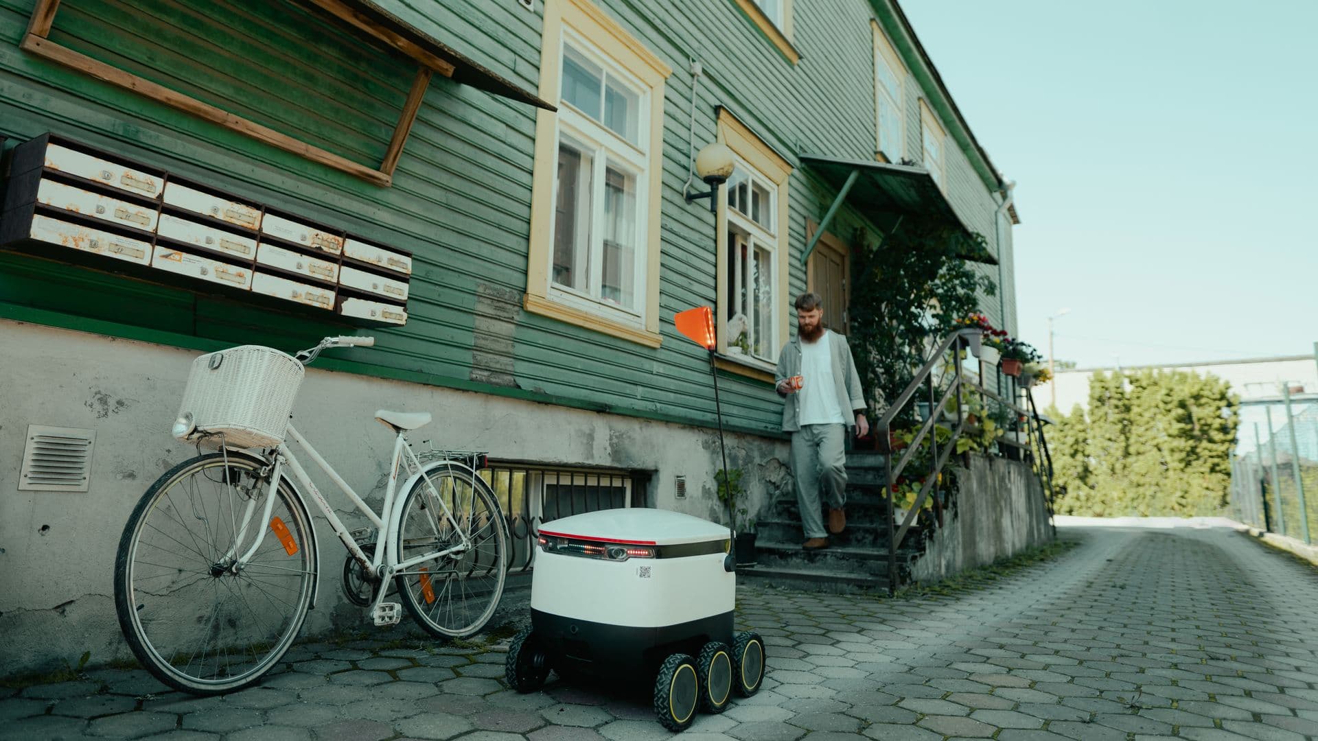 Starship robot delivering food to an Estonian man