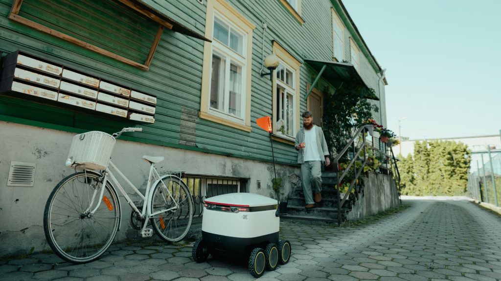 Starship robot delivering food to an Estonian man