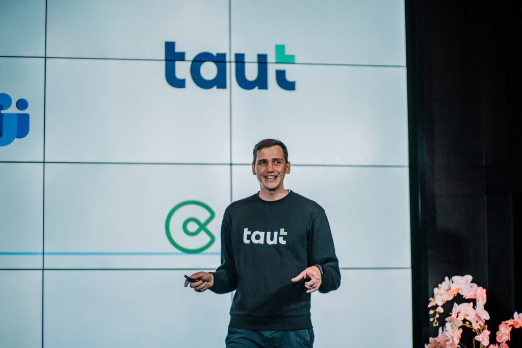 Latvian e-resident Kalvis Petersons onstage speaking about his EdTech company Taut.