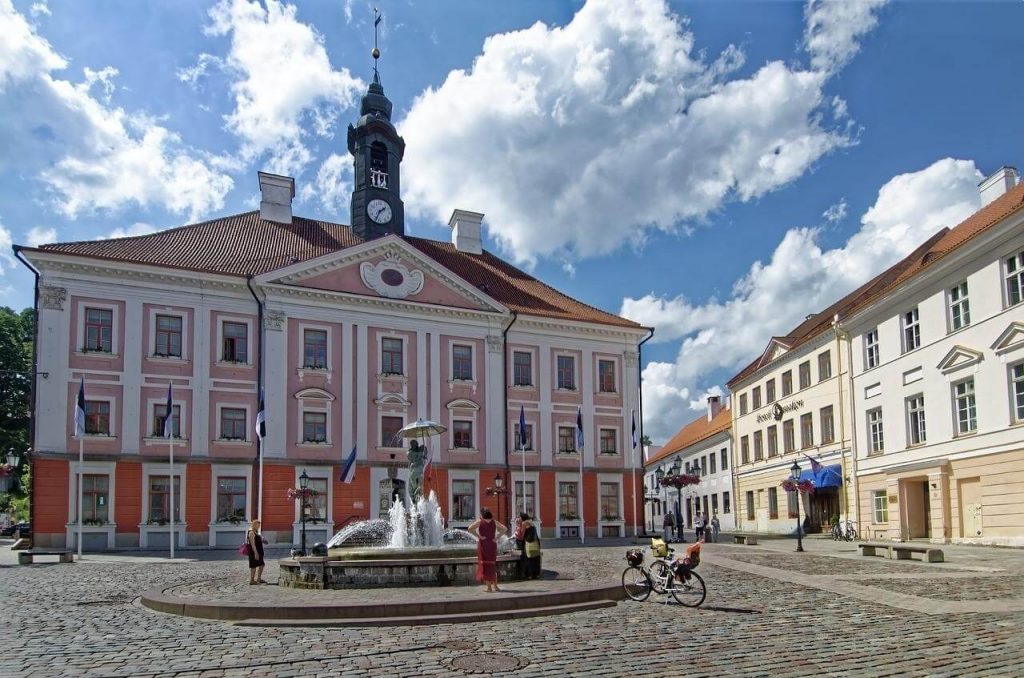 Tartu Town Hall on a blue sky day with a few white clouds