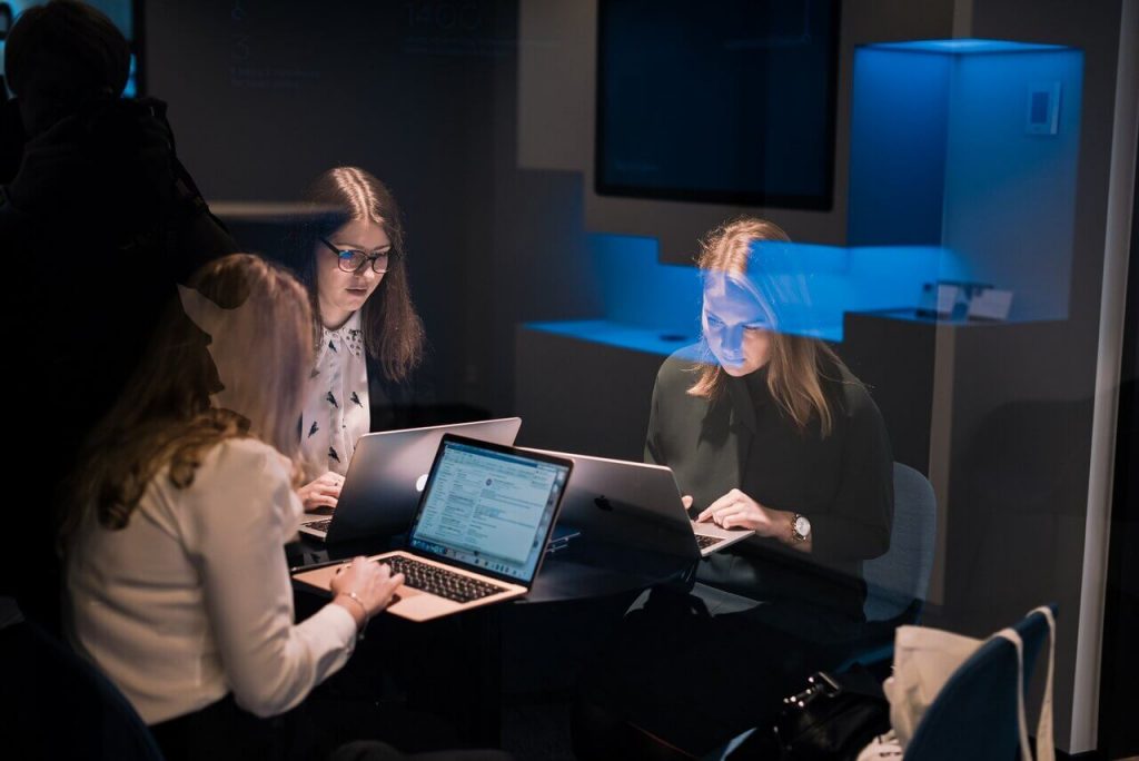 Women entrepreneurs in a business meeting on their laptops