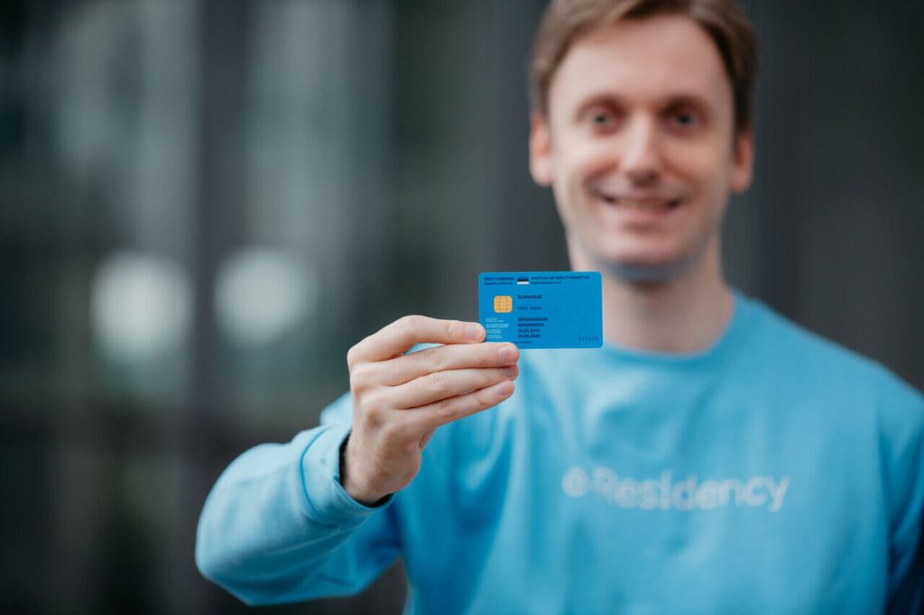 Man holding blue card in blue e-Residency sweater