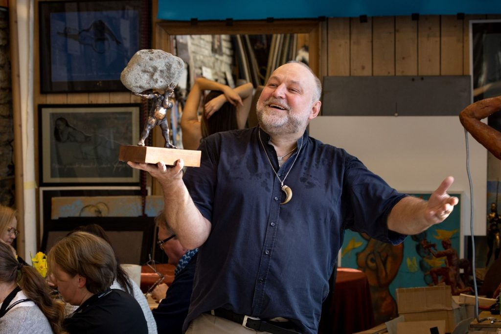 Artist Tauno Kangro showing off his sculpture