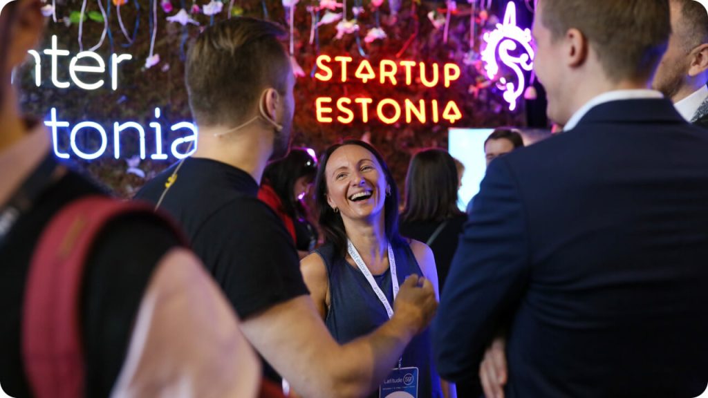 People smiling at Startup Estonia networking event
