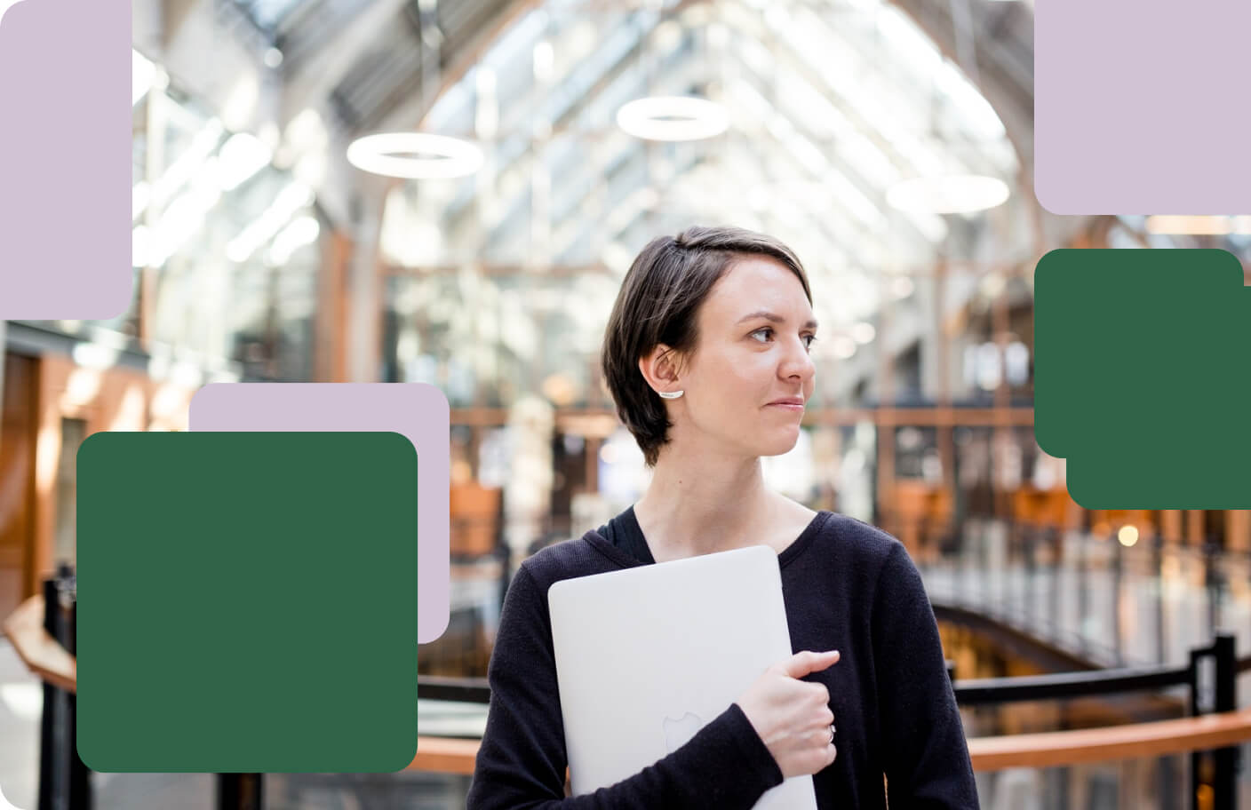 Woman securely holding a laptop