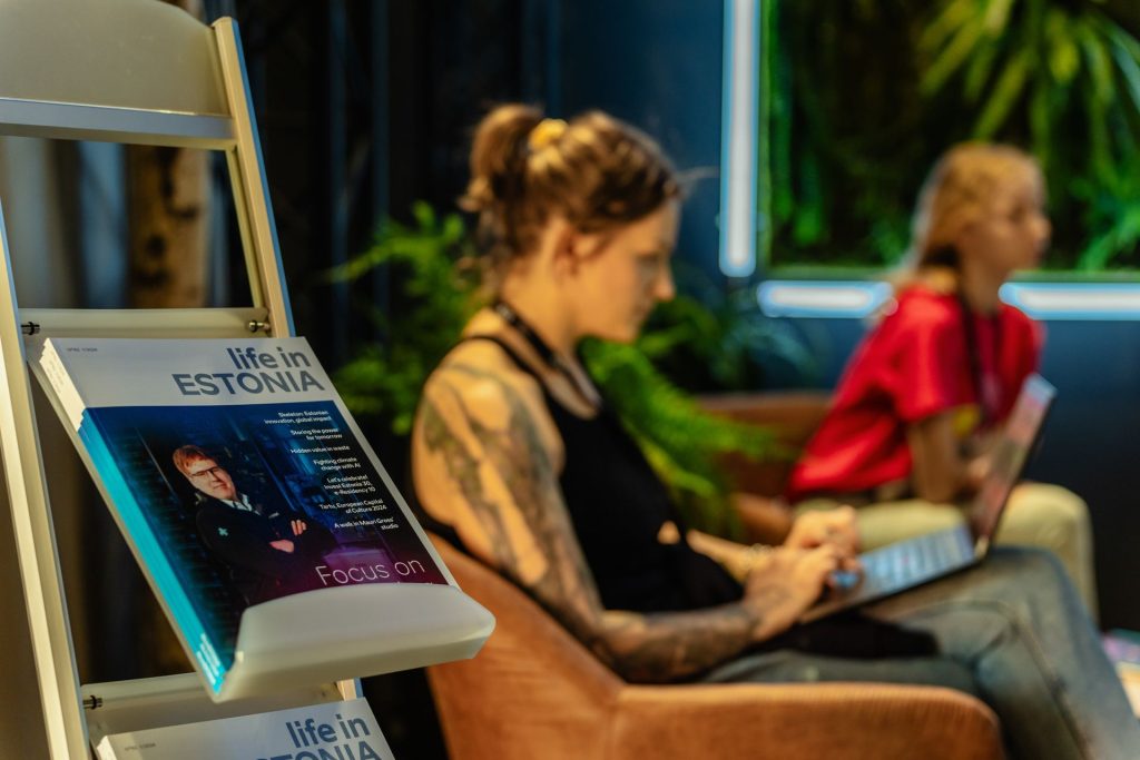 woman with laptop and newspaper