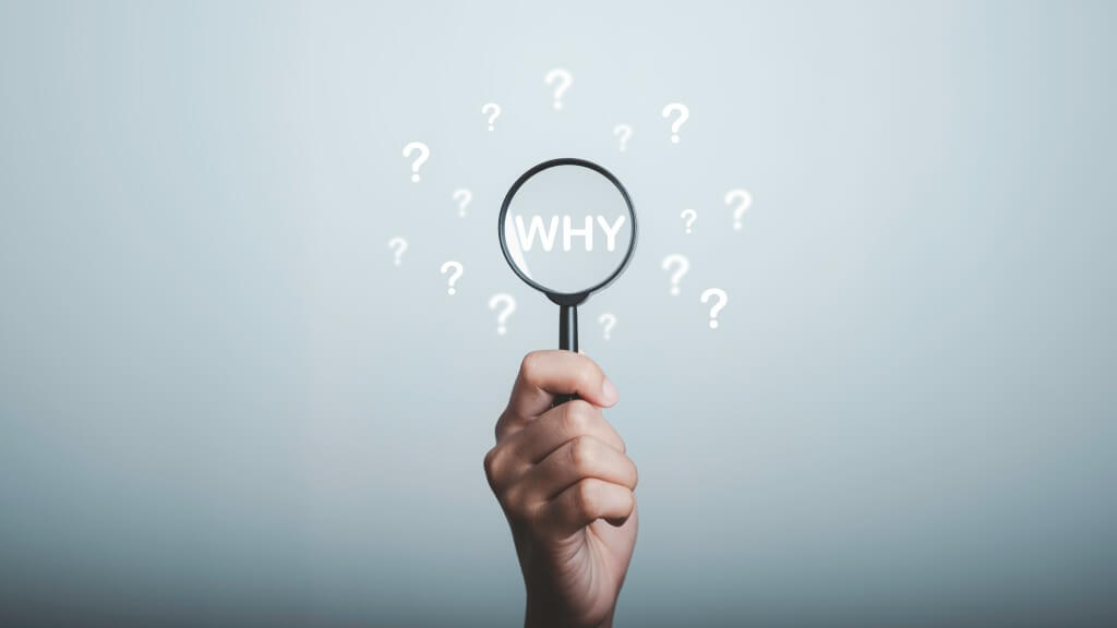 find your why: Why question in magnifying and question mark be around, What is your reason concept. Business answer and analysis, problem ask, interrogation, research information with copy space on grey background.