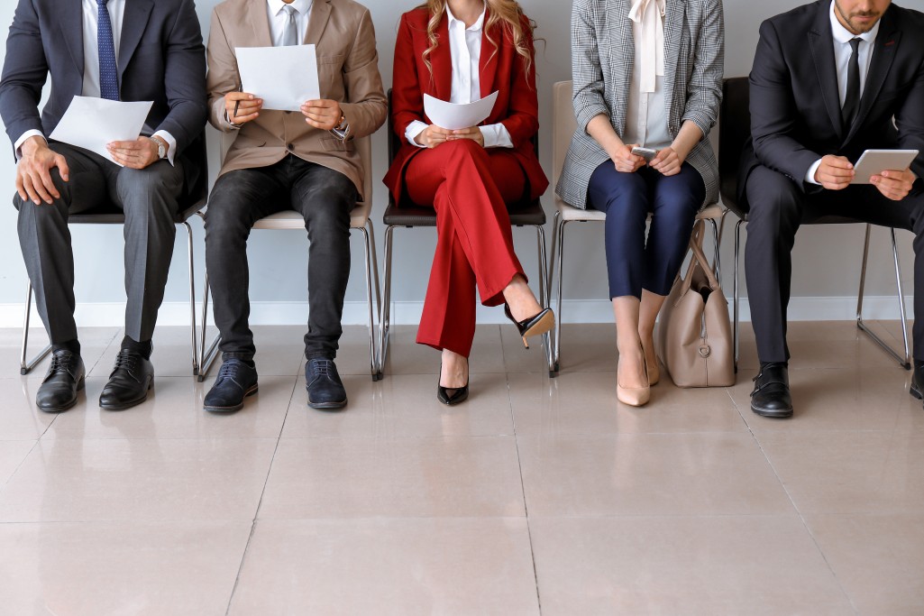 group of people sitting and waiting to be called into an interview to hire in Estonia
