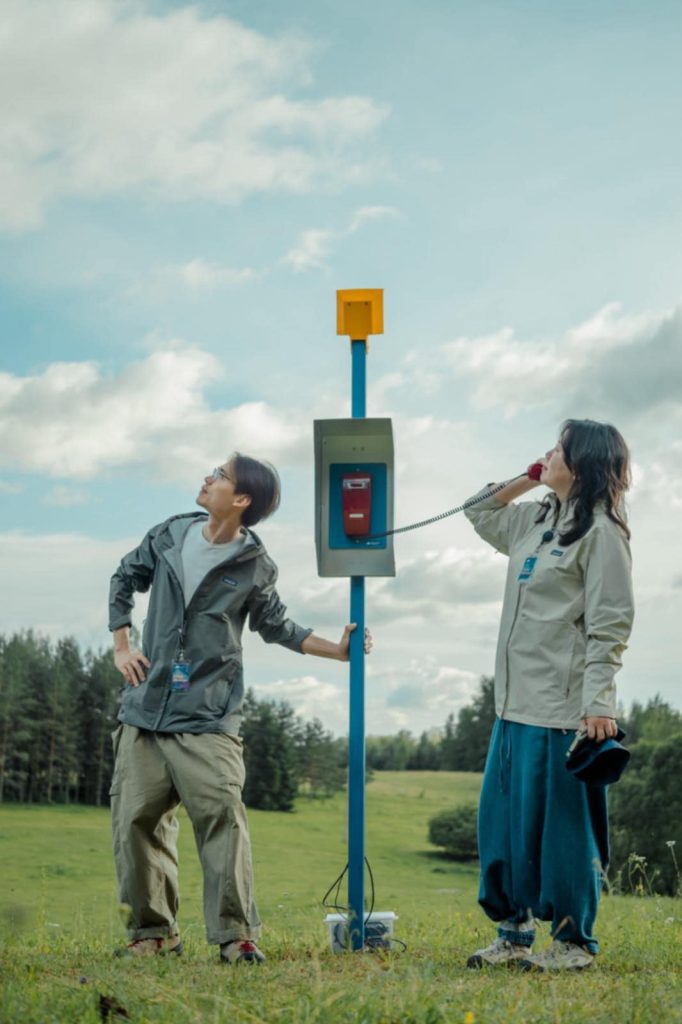 Artist duo and e-residents Alternative Systems (Yuguang Zhang and Tong Wu) pose with their outdoor art exhibit in Estonia