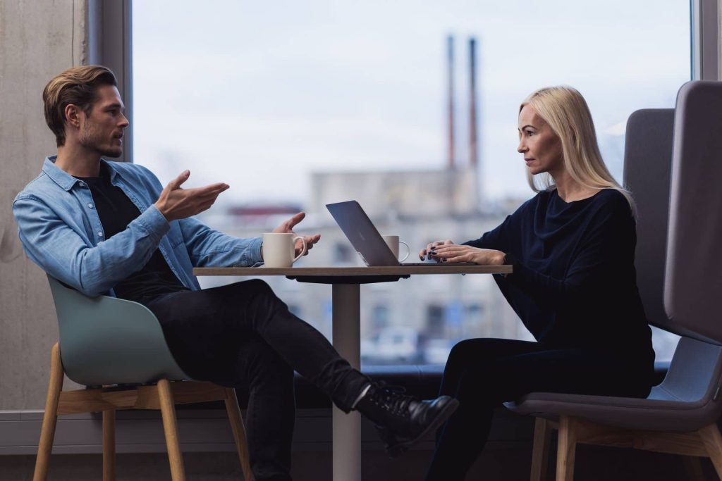 Two people talking about business ideas